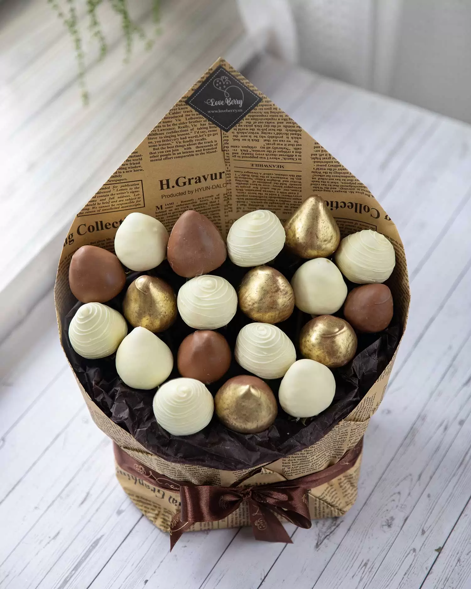 gold leaf covered strawberry arrangements