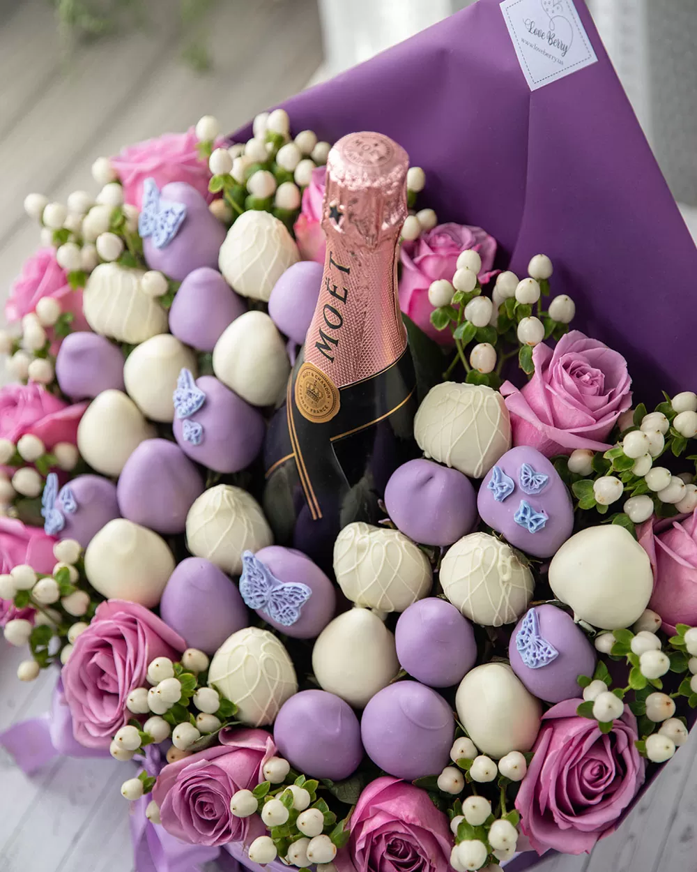 purple and white chocolate covered strawberry arrangement