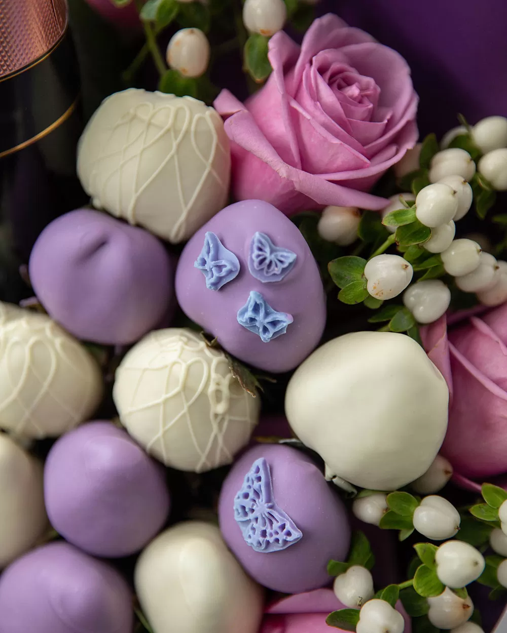 purple and white chocolate covered strawberry arrangement
