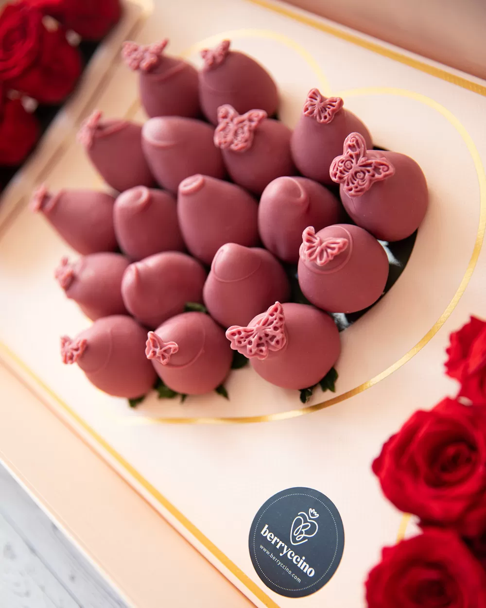 red roses with ruby chocolate covered strawberry arrangements