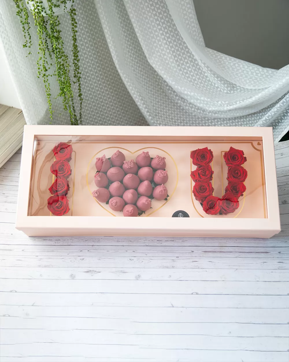 red roses with ruby chocolate covered strawberry arrangements
