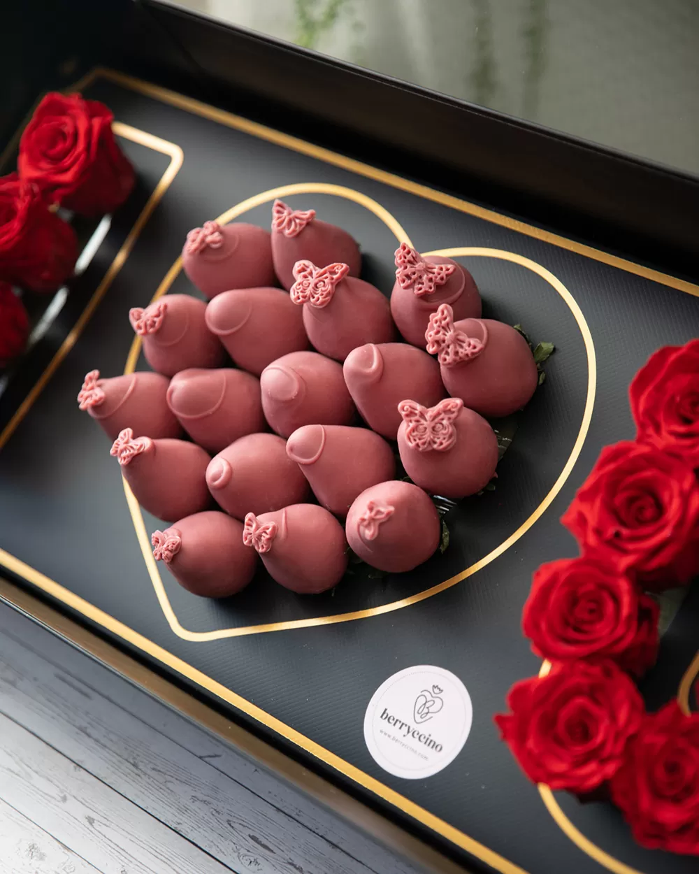 red flowers with ruby chocolate strawberries