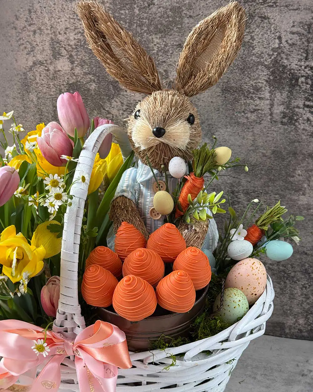 Handmade Easter gift basket with flowers and carrot-style chocolate strawberries