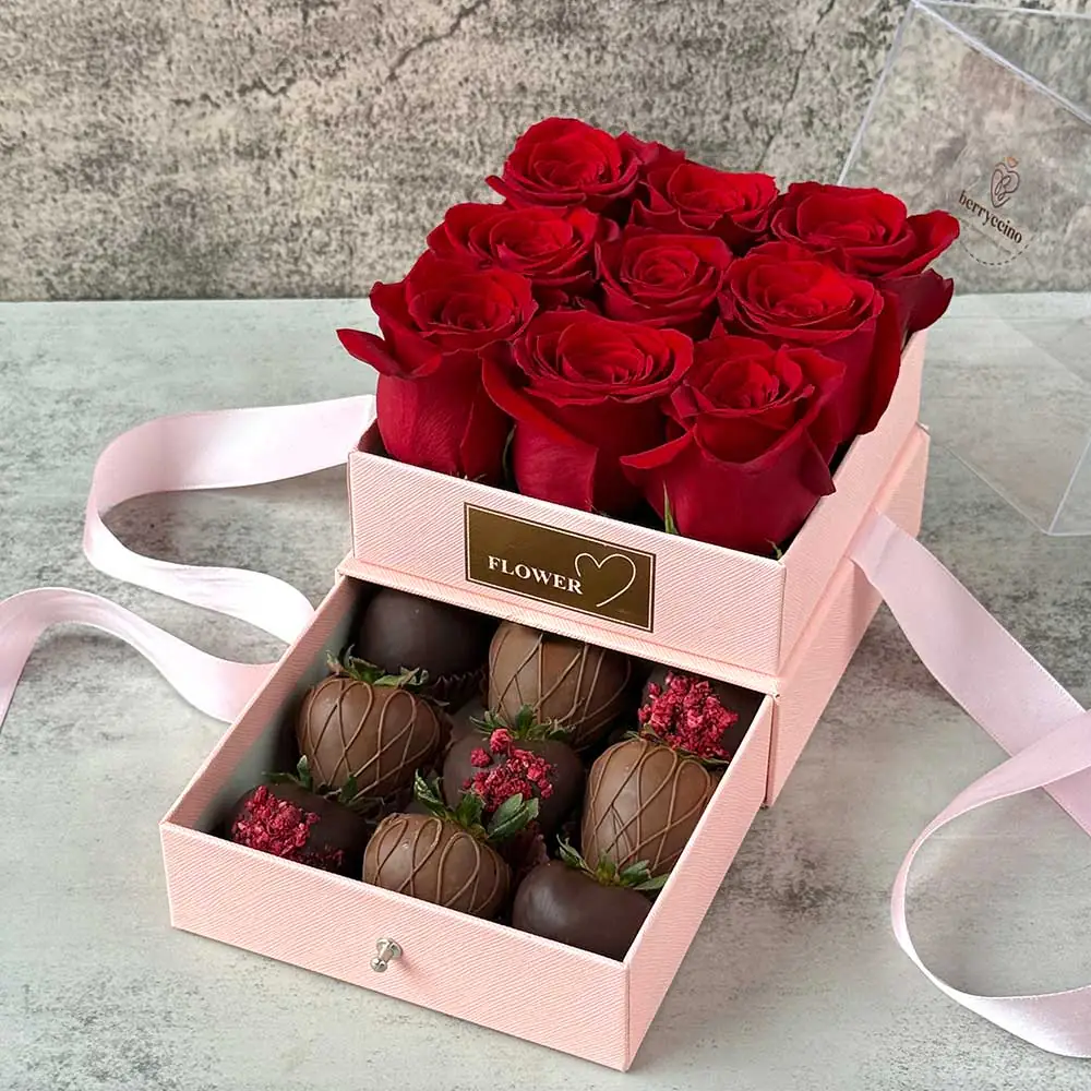 Mother’s Day gift box with red roses and chocolate-covered strawberries