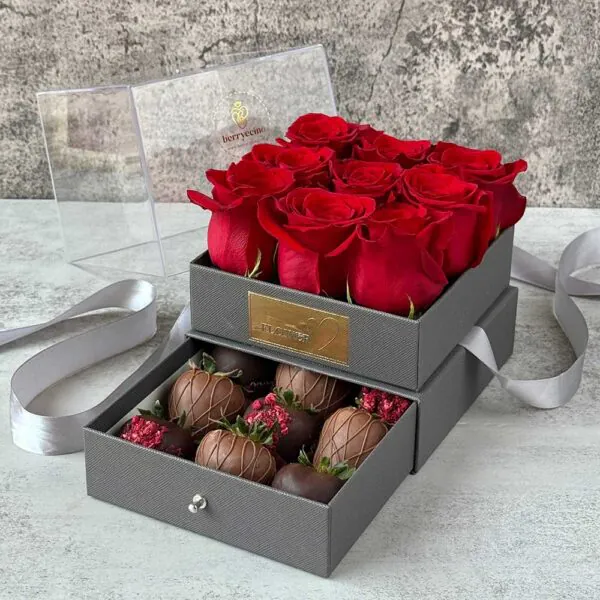 Gray luxury gift box with red roses and chocolate-covered strawberries for Mother’s Day