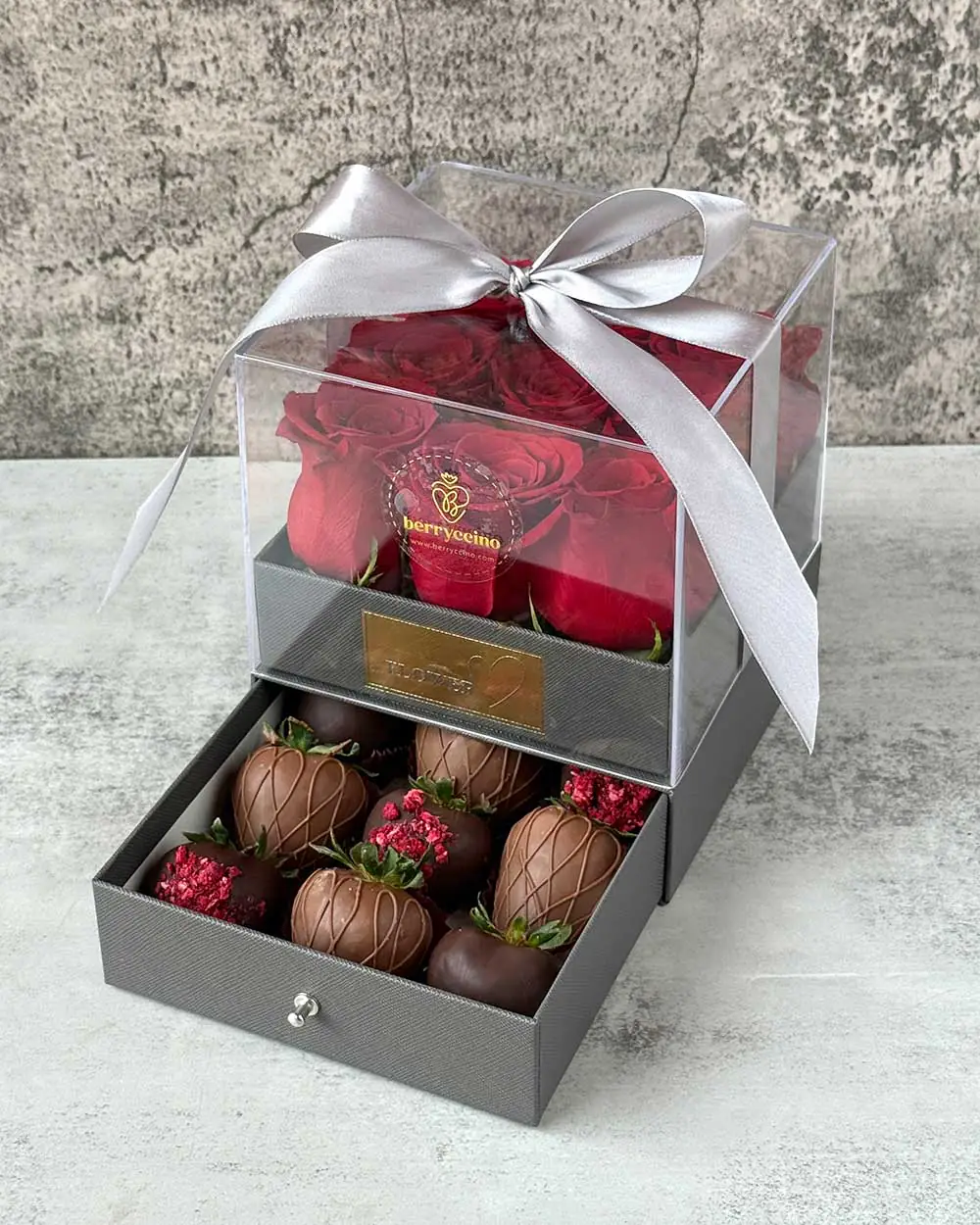 Elegant flower and chocolate arrangement in gray box with satin ribbon